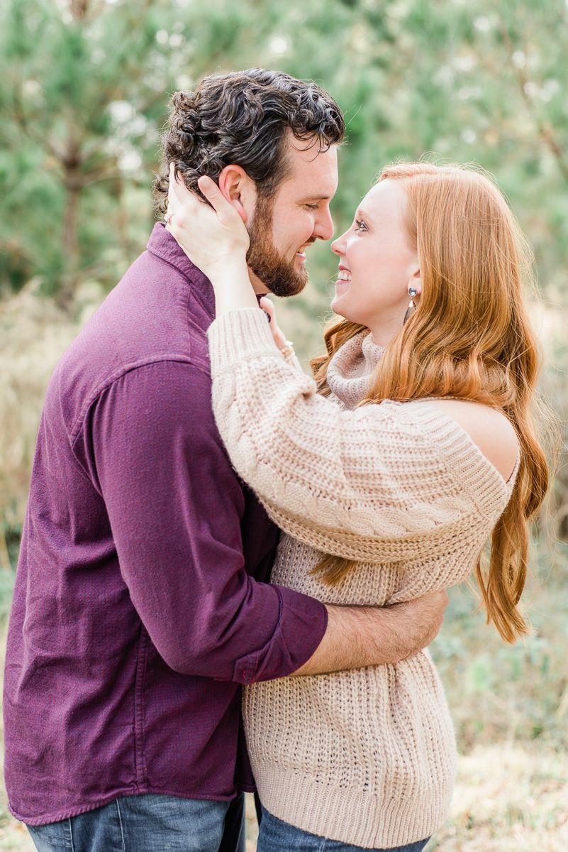 couple at their cozy fall engagement session at Memorial Park