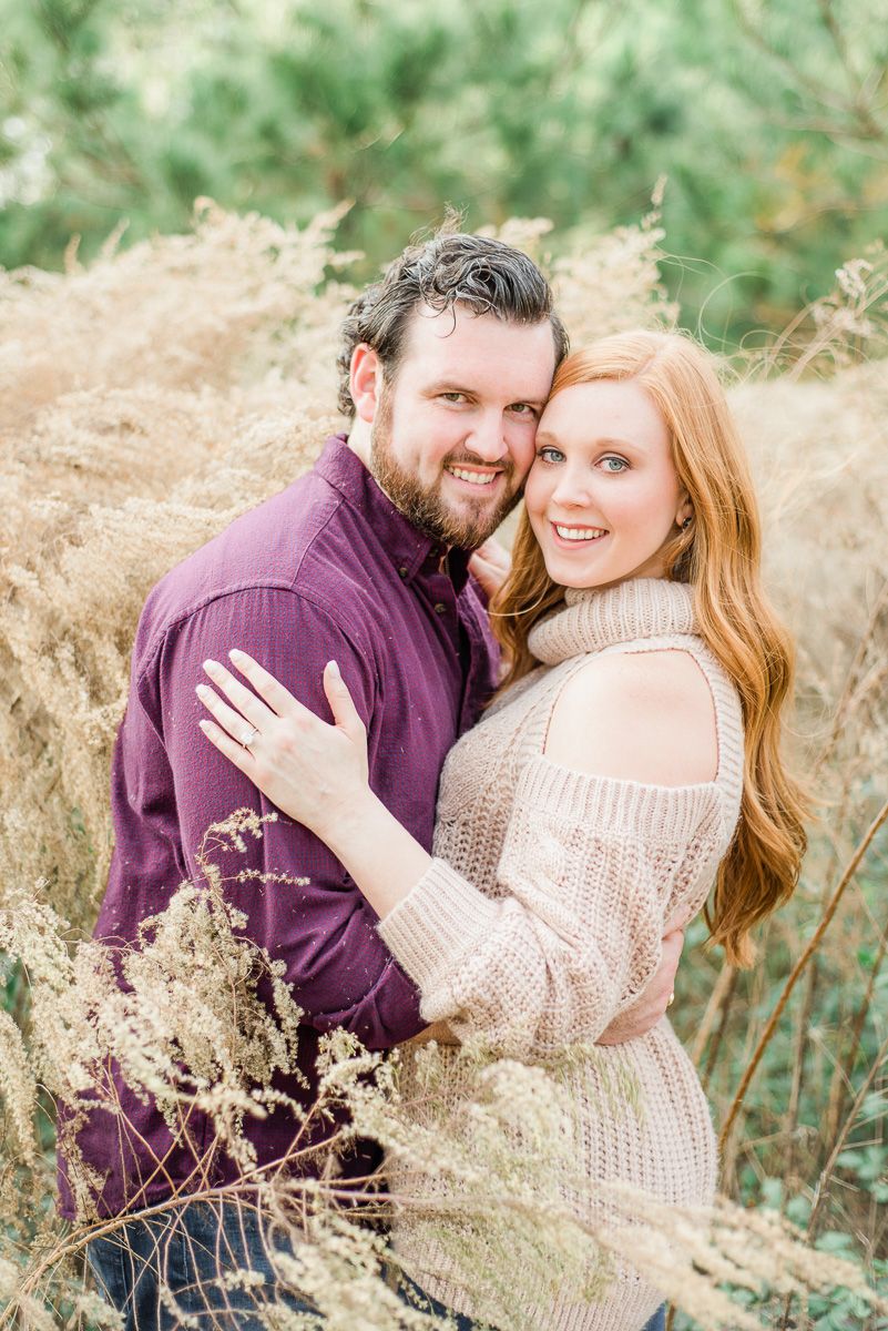 couple at their cozy fall engagement session at Memorial Park
