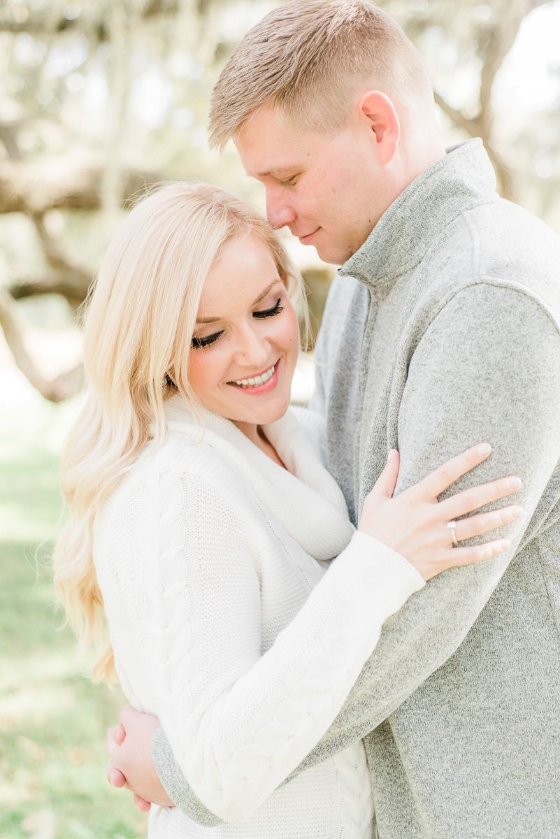 a couple cuddling at engagement session