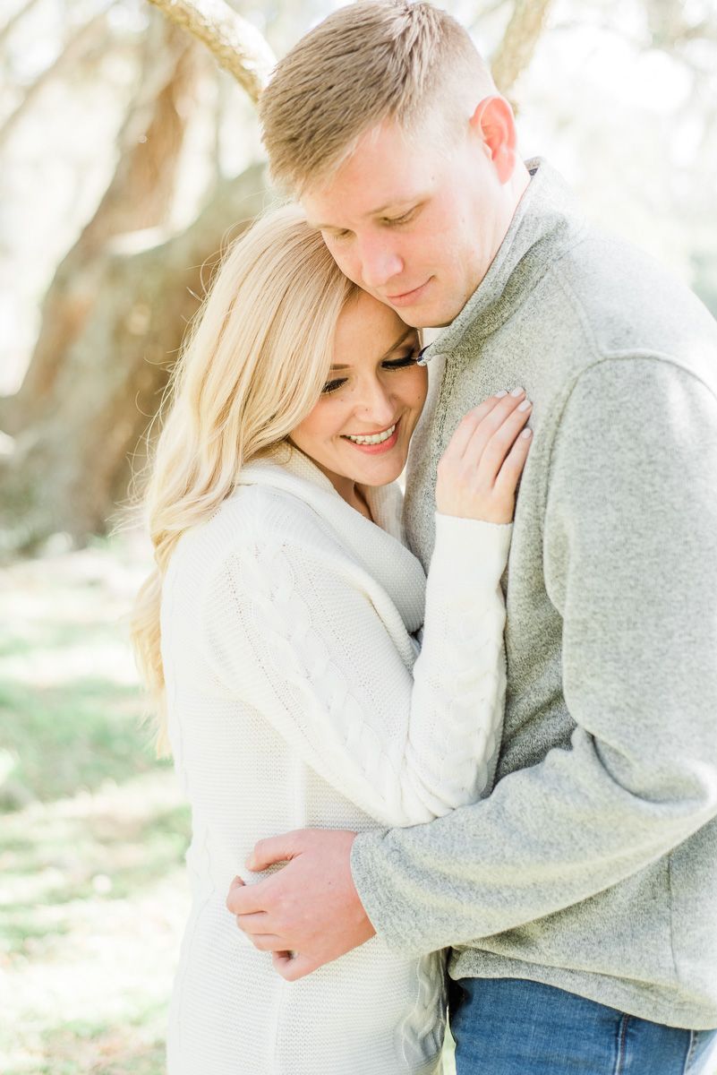 a couple with Spanish moss in Texas