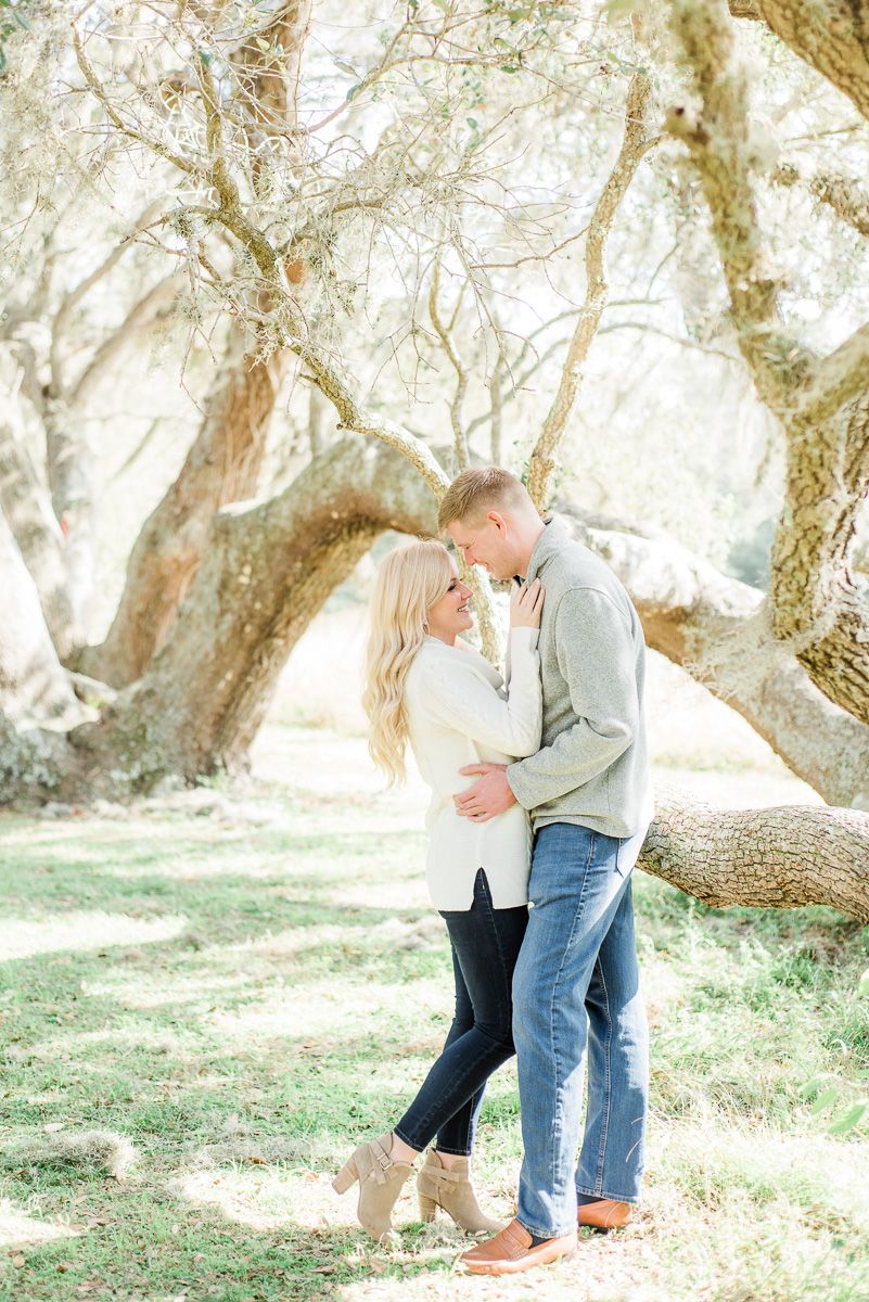 a couple with Spanish moss in Texas