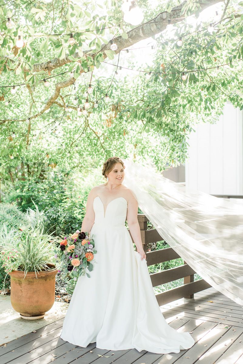 bride outside The Carriage House in Conroe