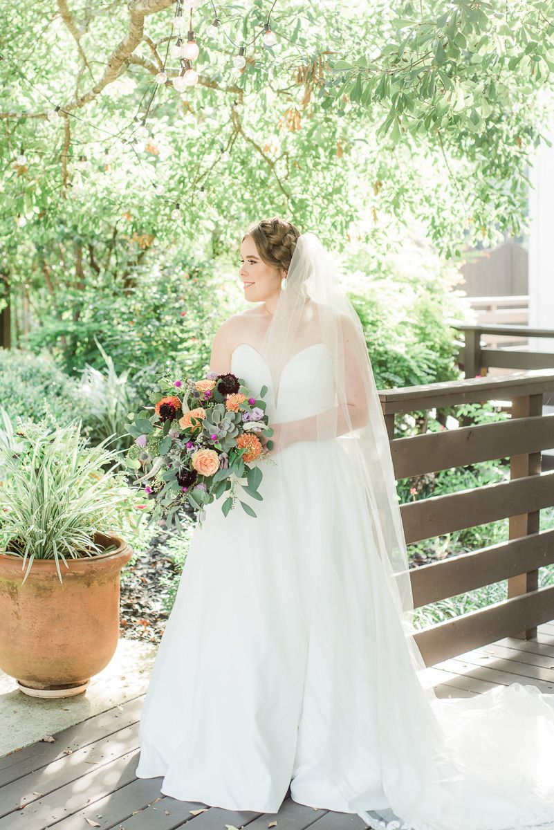 bride outside The Carriage House in Conroe
