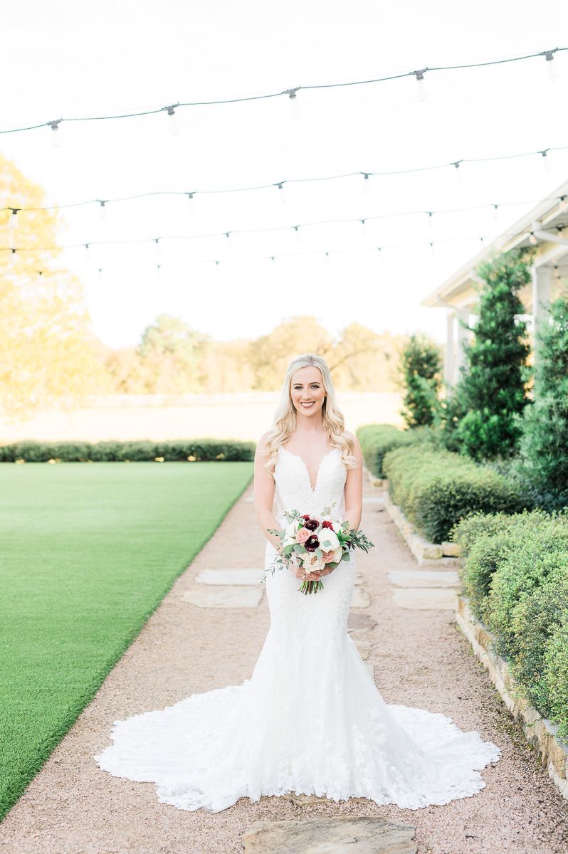 bride posing at her bridal session at The Farmhouse