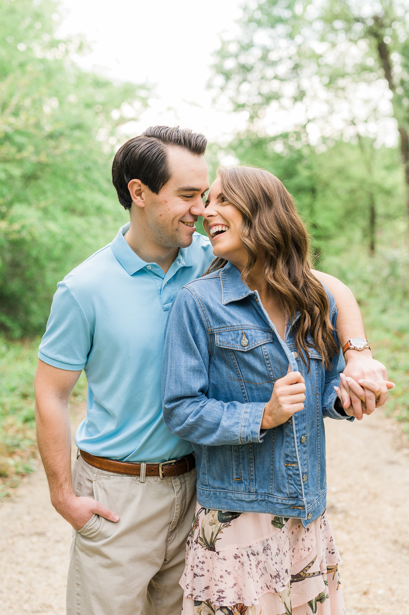 couple cuddling during engagement photos