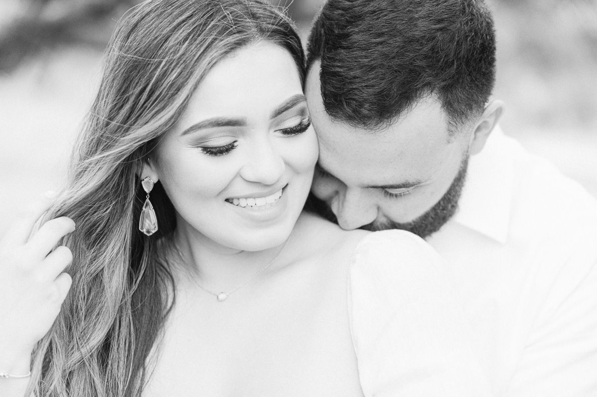 couple cuddling at engagement photo session