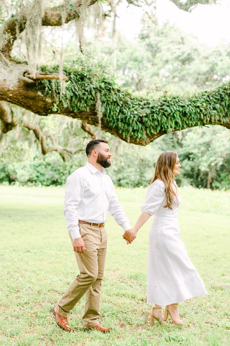 couple walking during engagement photos
