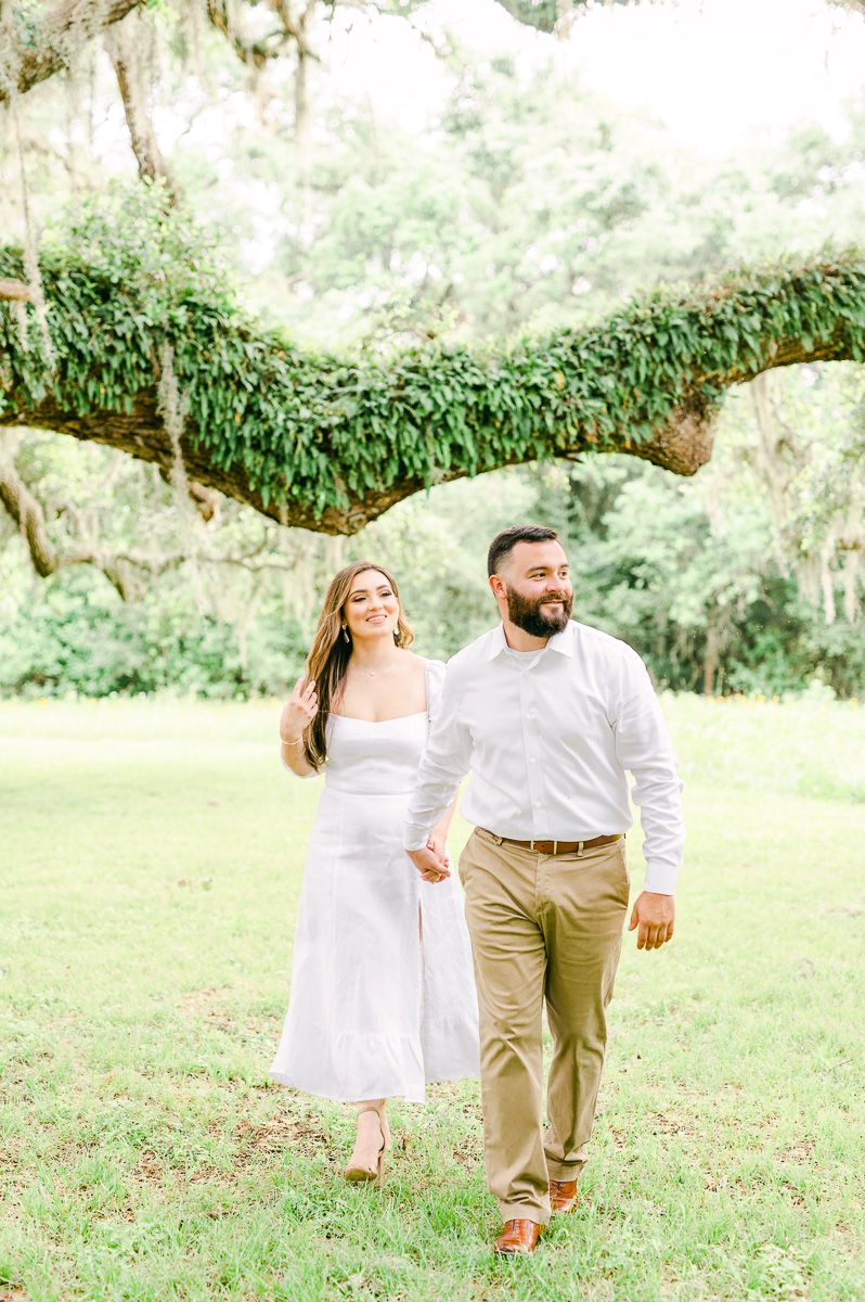 couple walking during engagement photo session