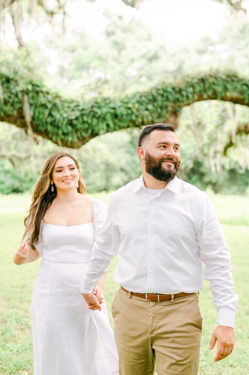 couple walking during engagement photo session
