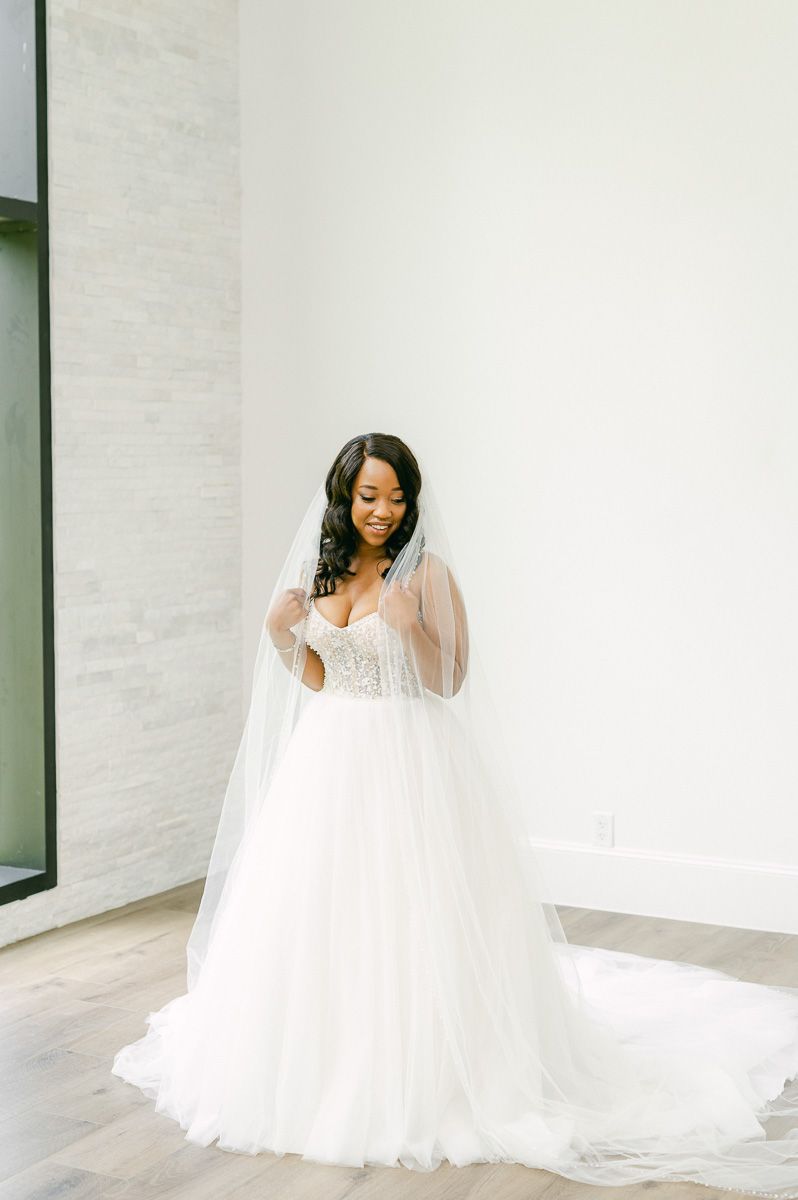 bride wearing long veil at The Luminaire