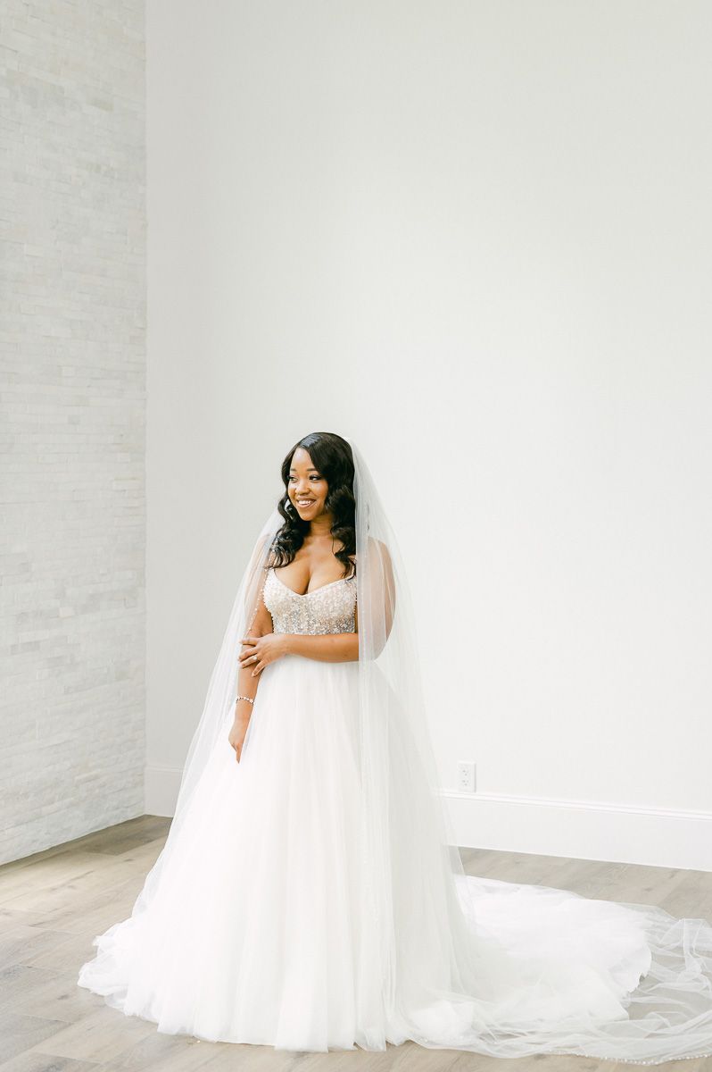 bride wearing long veil at The Luminaire