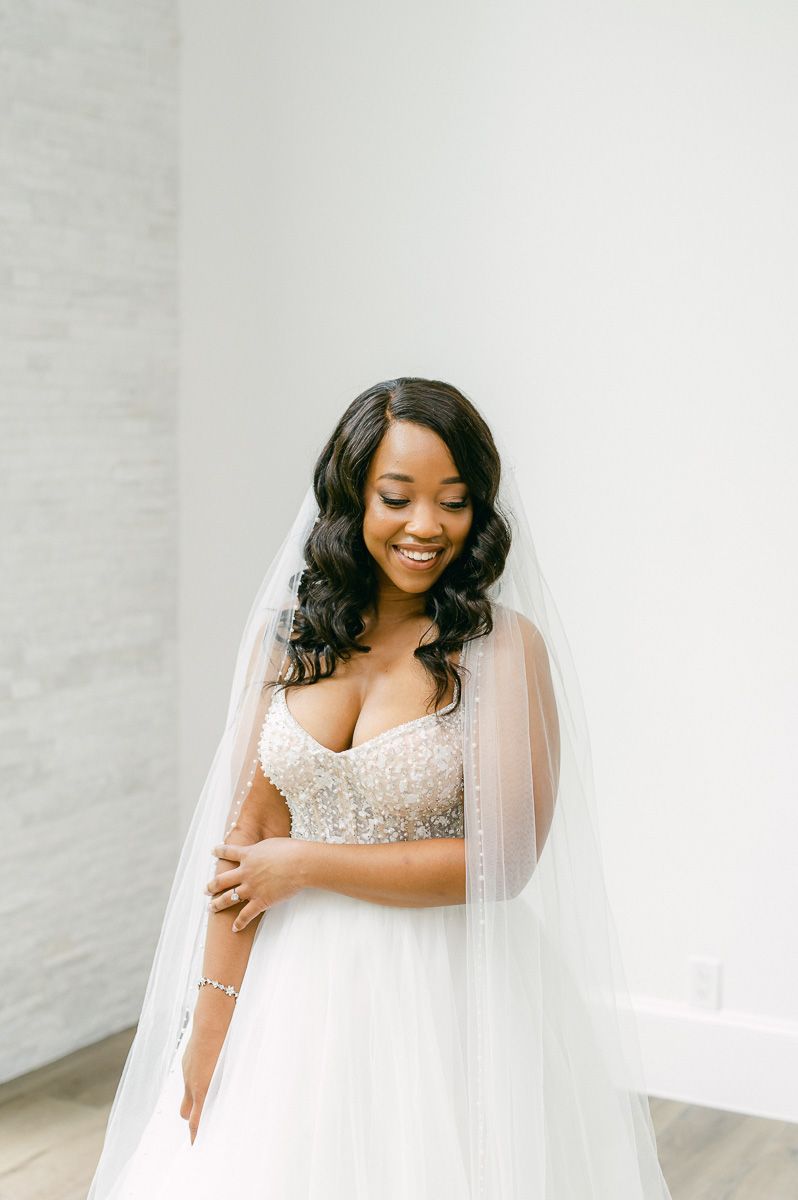 bride wearing long veil at The Luminaire