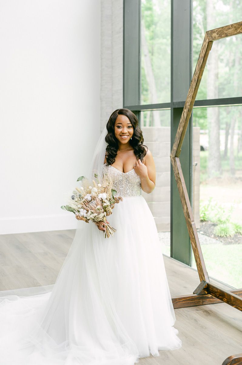 bride holding natural wedding bouquet