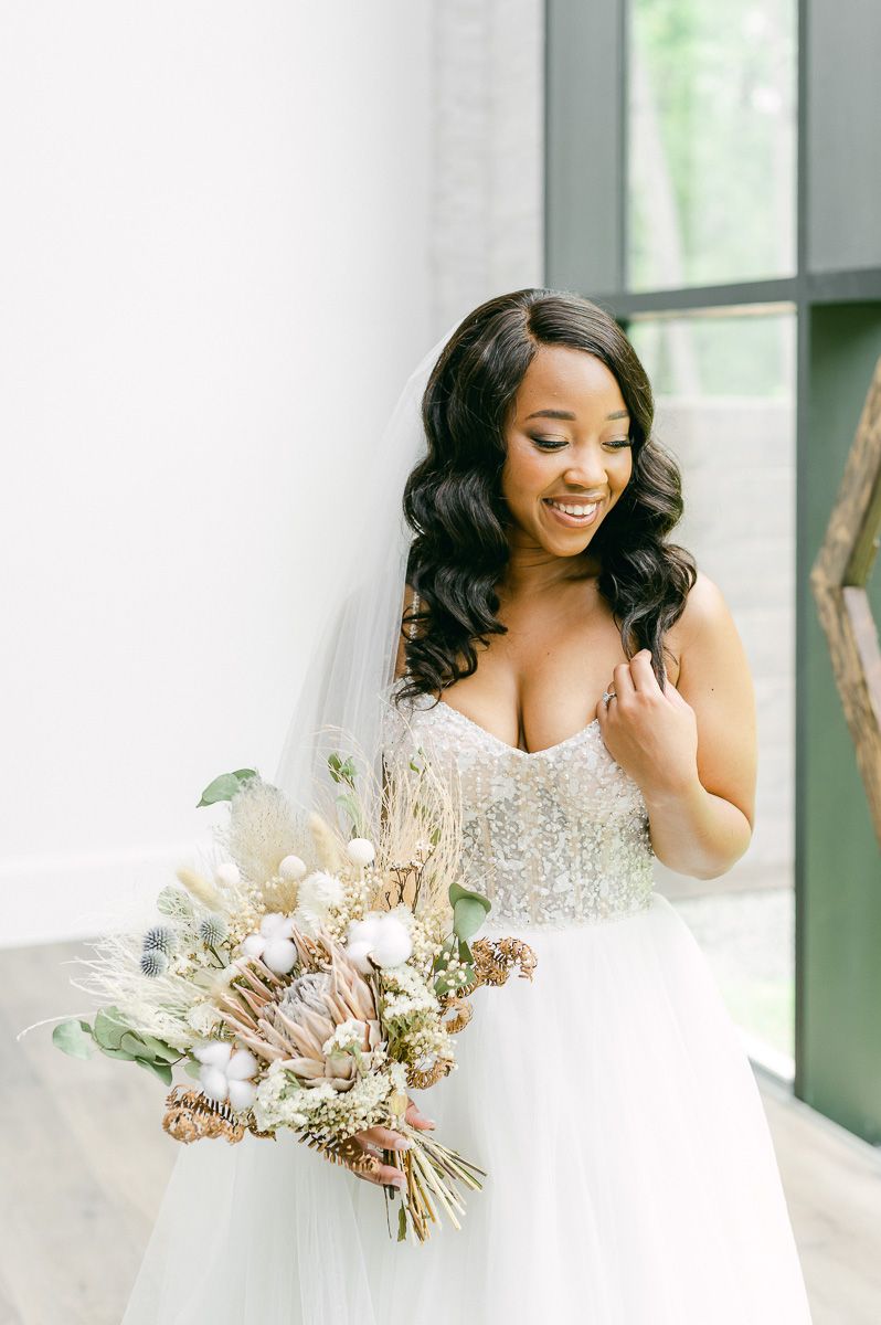 bride holding natural wedding bouquet