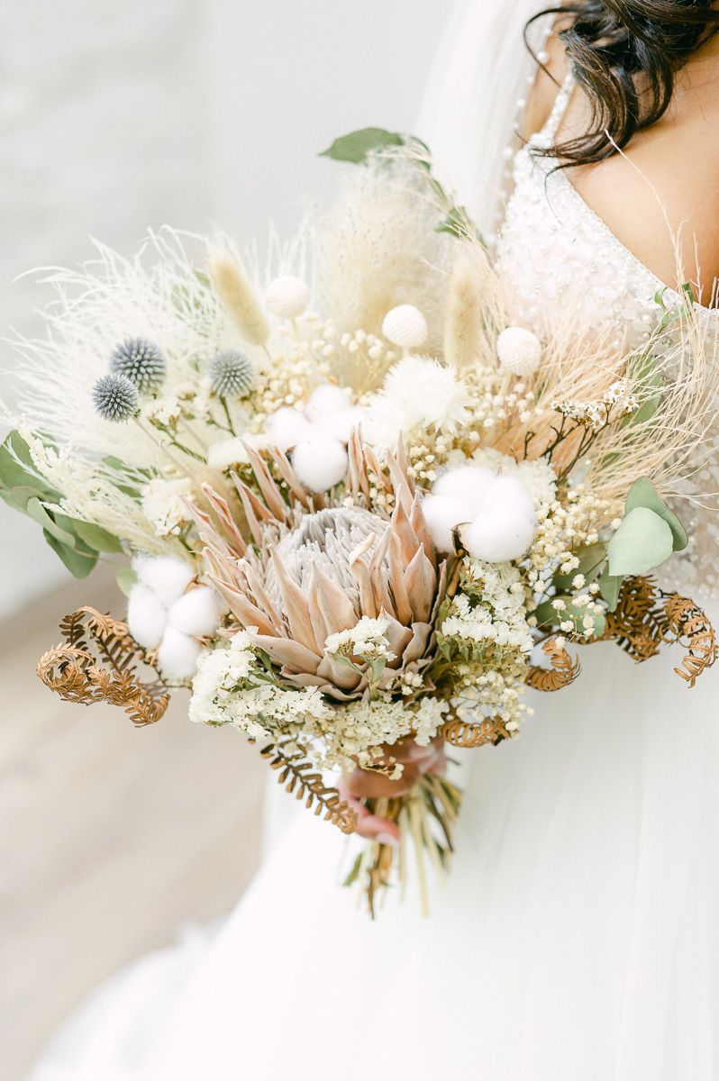 bride holding bouquet at Conroe wedding venue