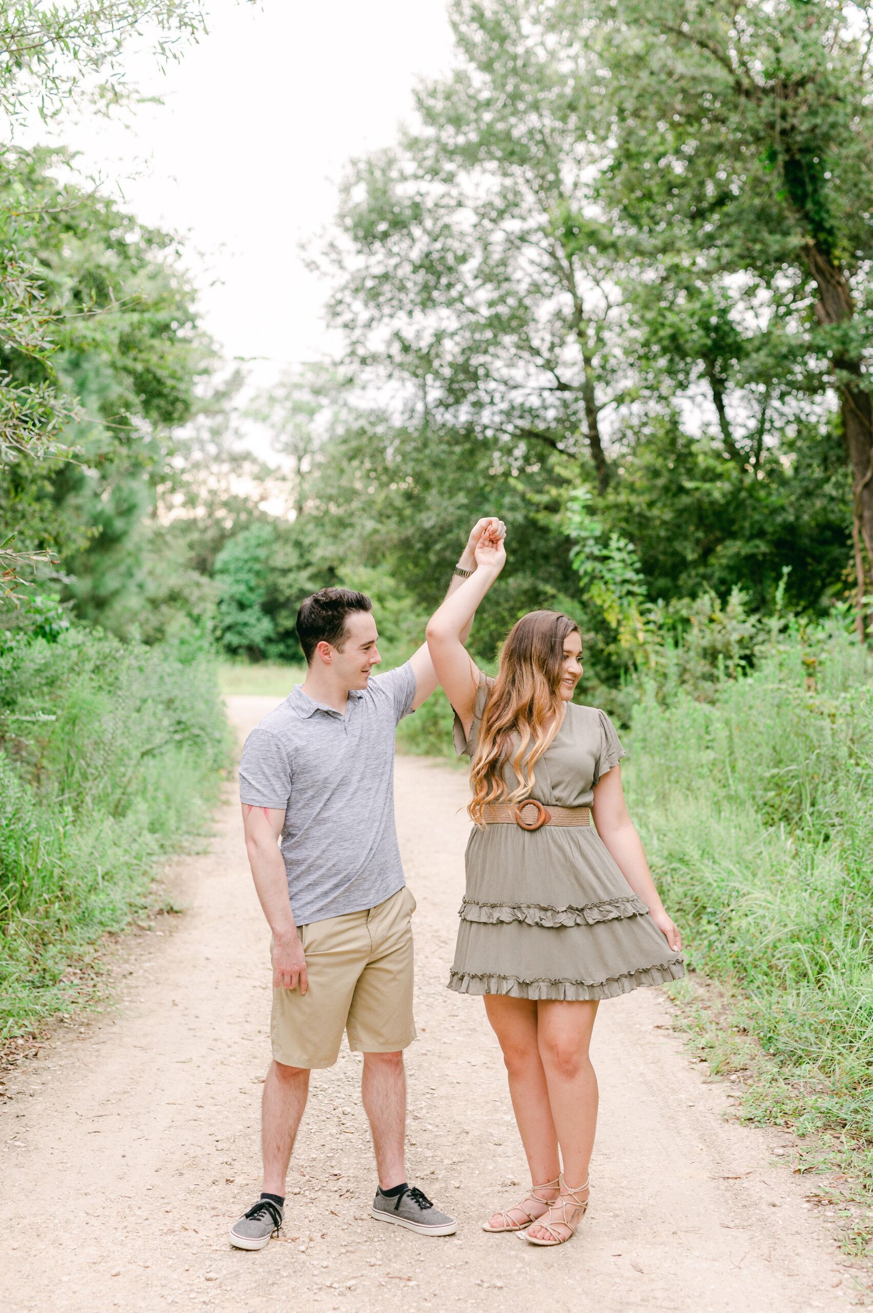 couple dancing at engagement session in houston