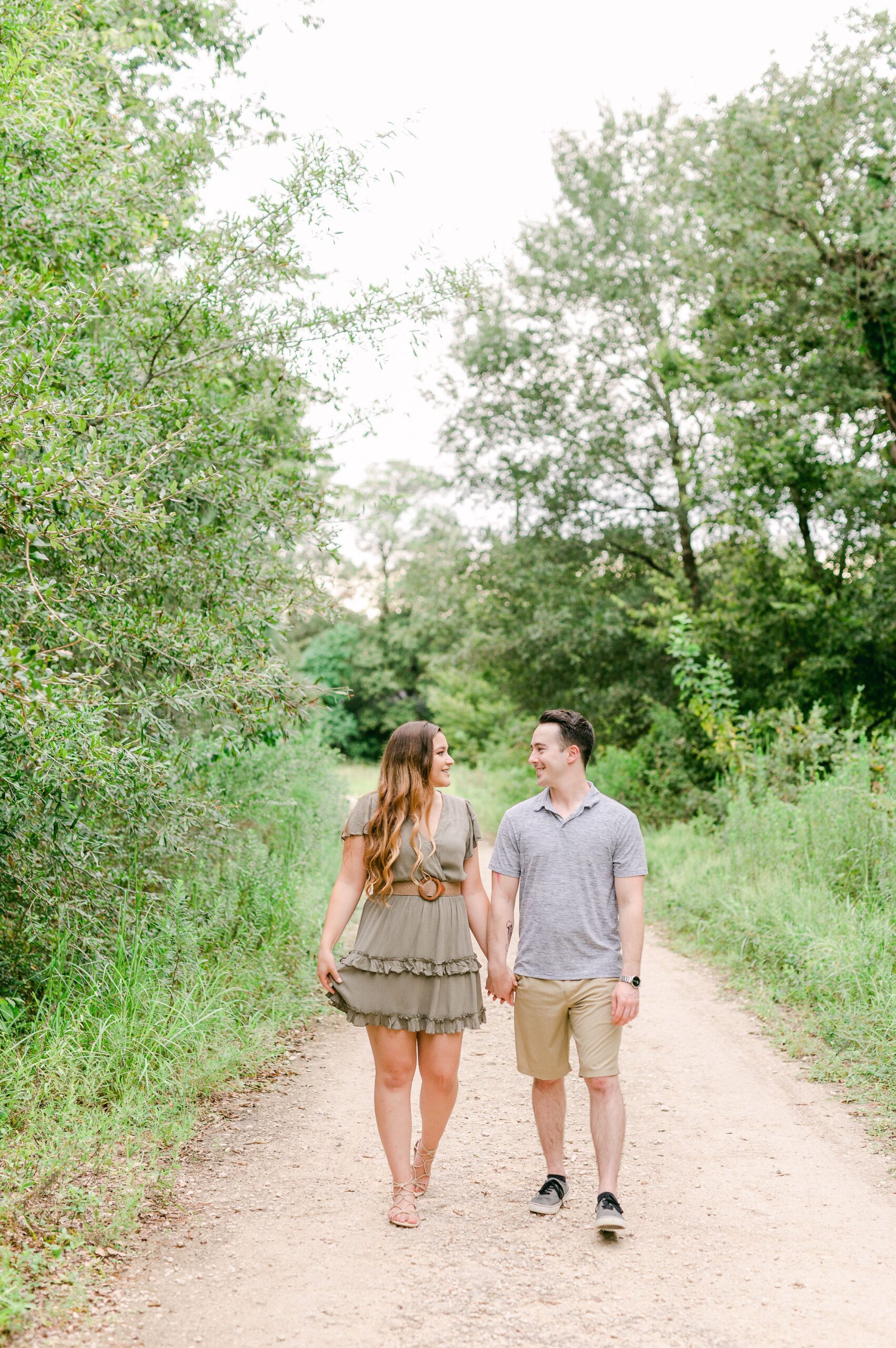 couple walking at engagement session in houston