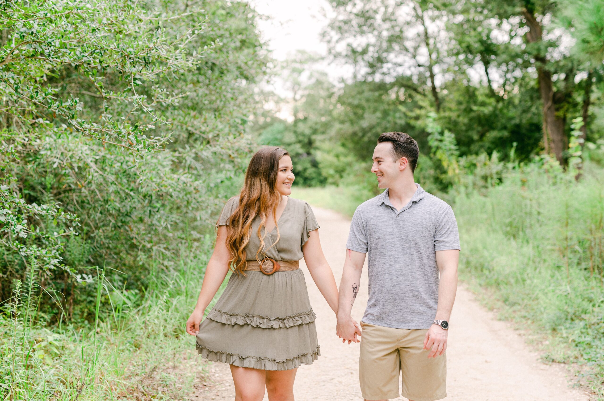 couple walking at engagement session in houston