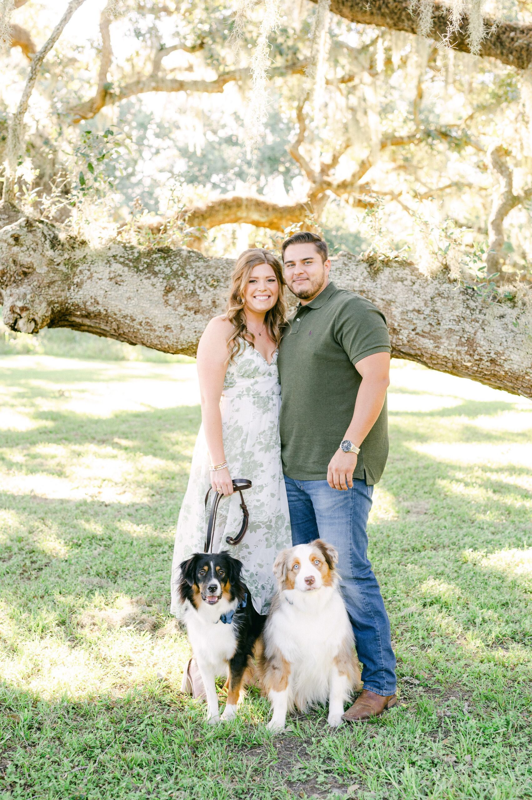 couple at Brazos Bend State Park with their two dogs
