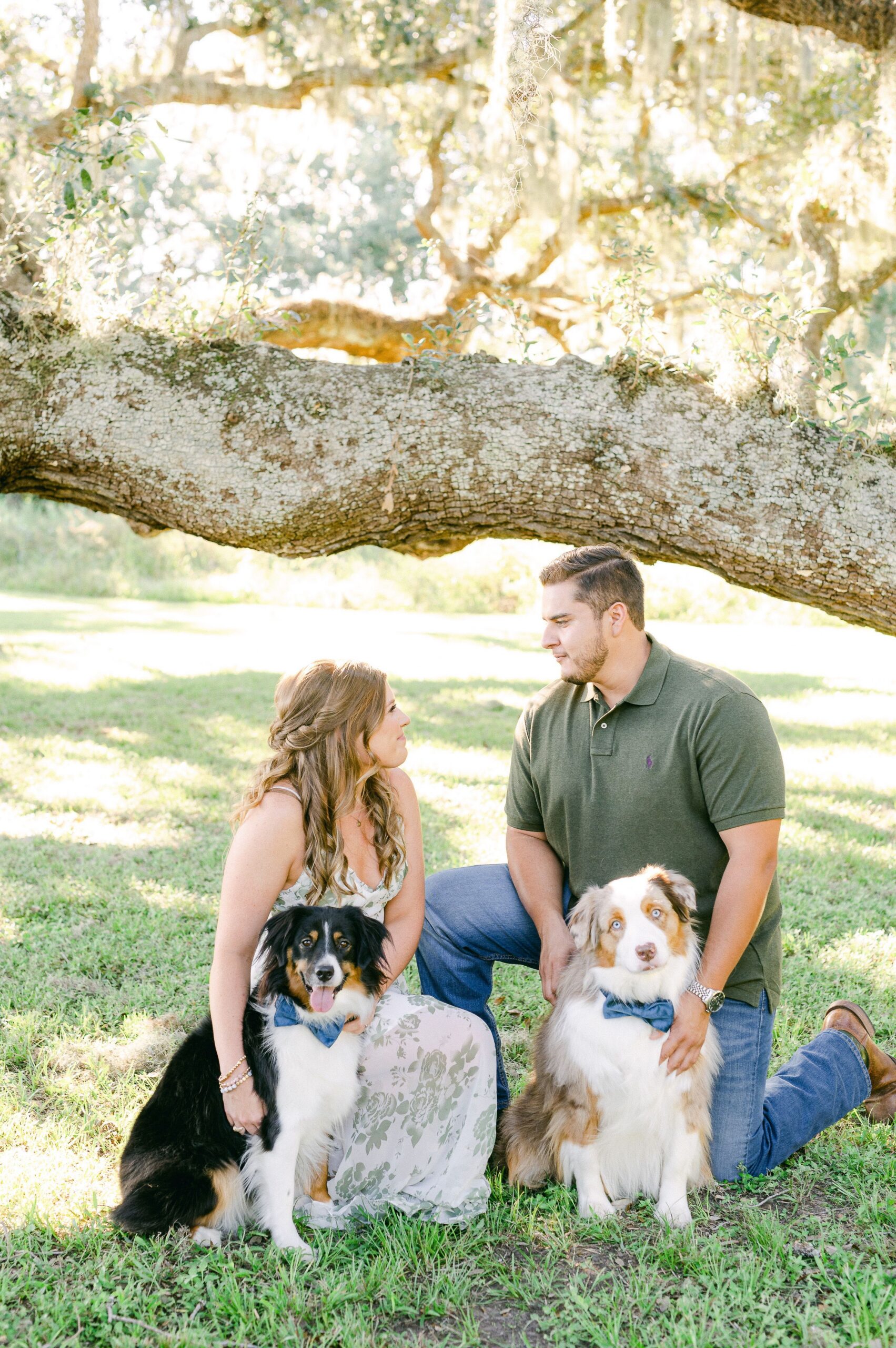 couple at Brazos Bend State Park with their two dogs