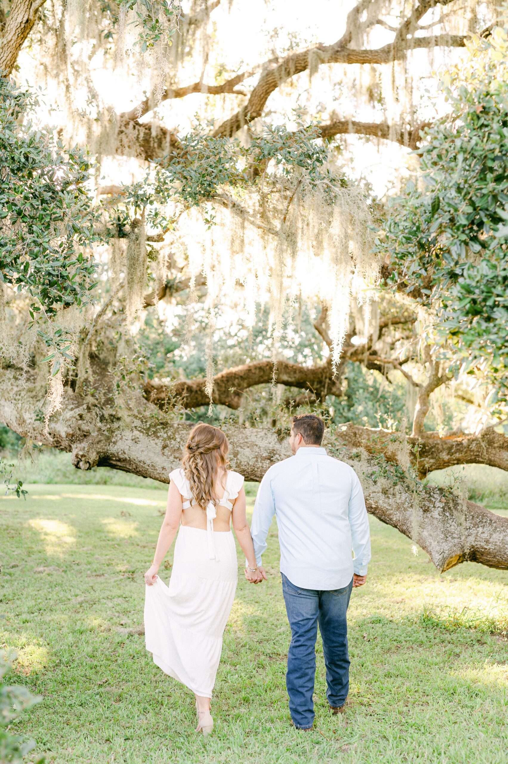 couple walking during engagement photo session