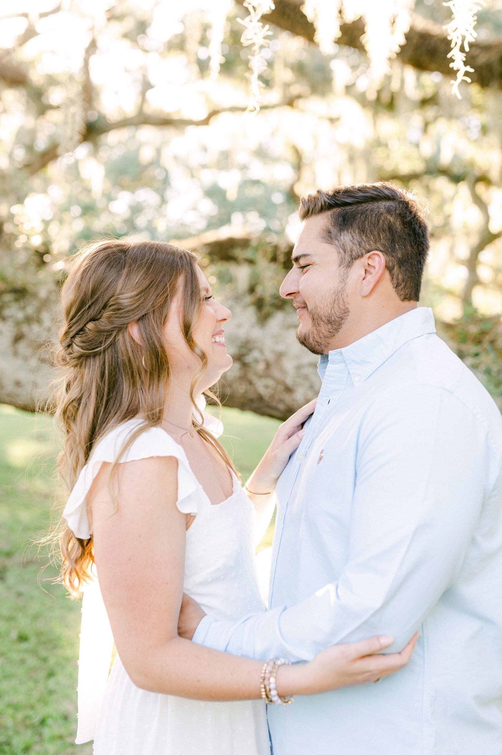 couple cuddling during engagement photos