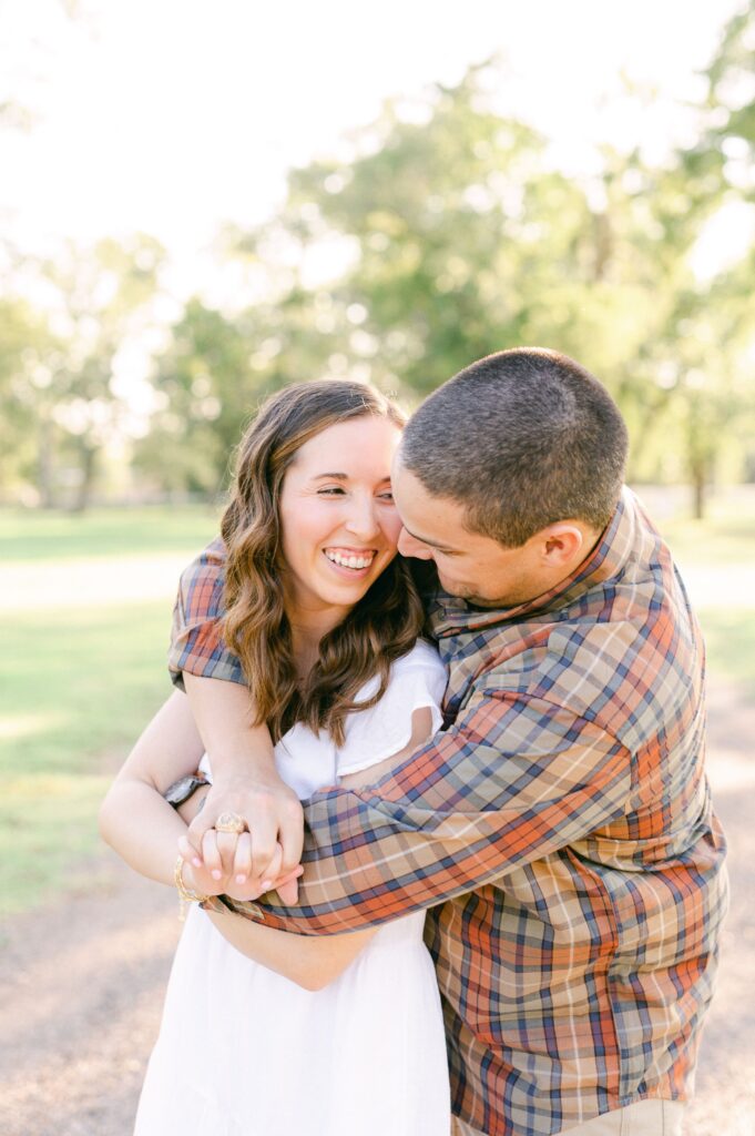 couple cuddling during Katy Tx Engagement