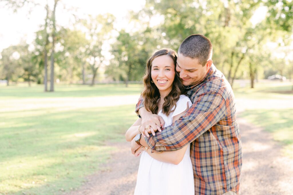 couple cuddling during Katy Tx Engagement