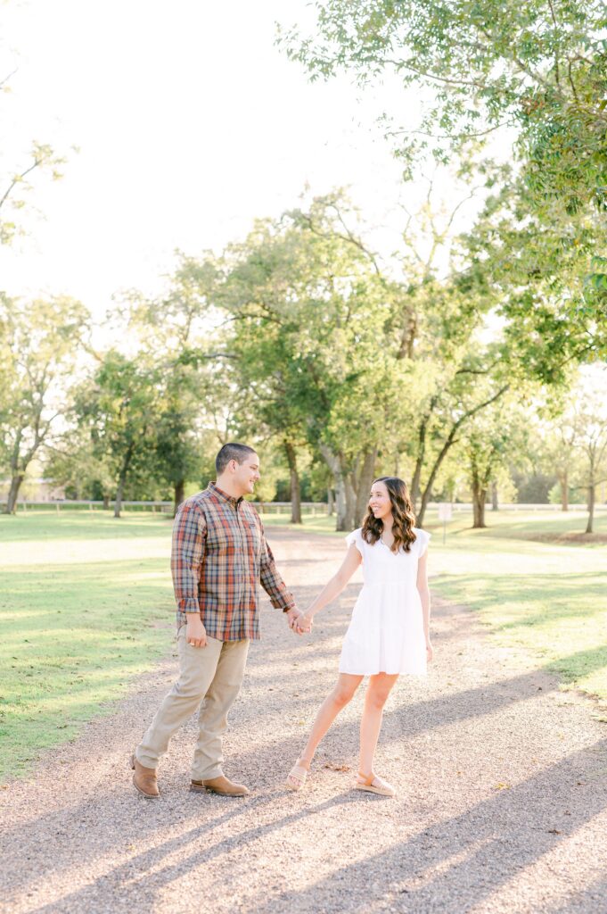 couple walking during fall engagement session