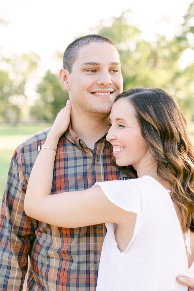 couple cuddling during Katy Tx Engagement
