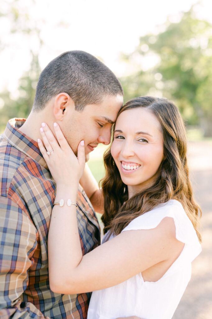 couple cuddling during fall engagement session