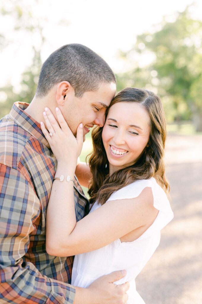 couple cuddling during Katy Tx Engagement
