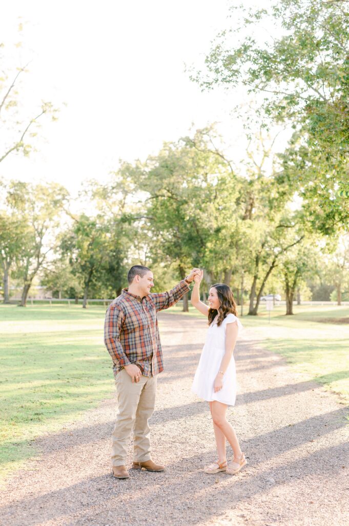 couple dancing during fall engagement photos