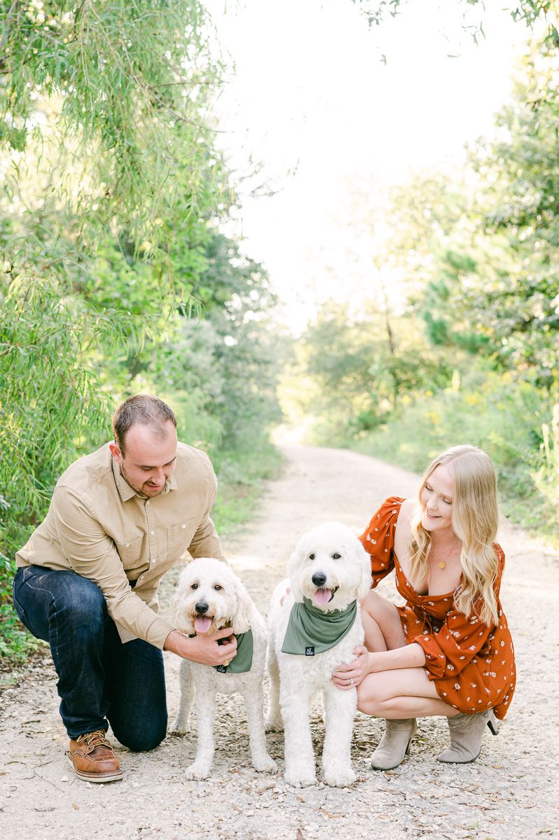 couple with their two dogs in Memorial Park
