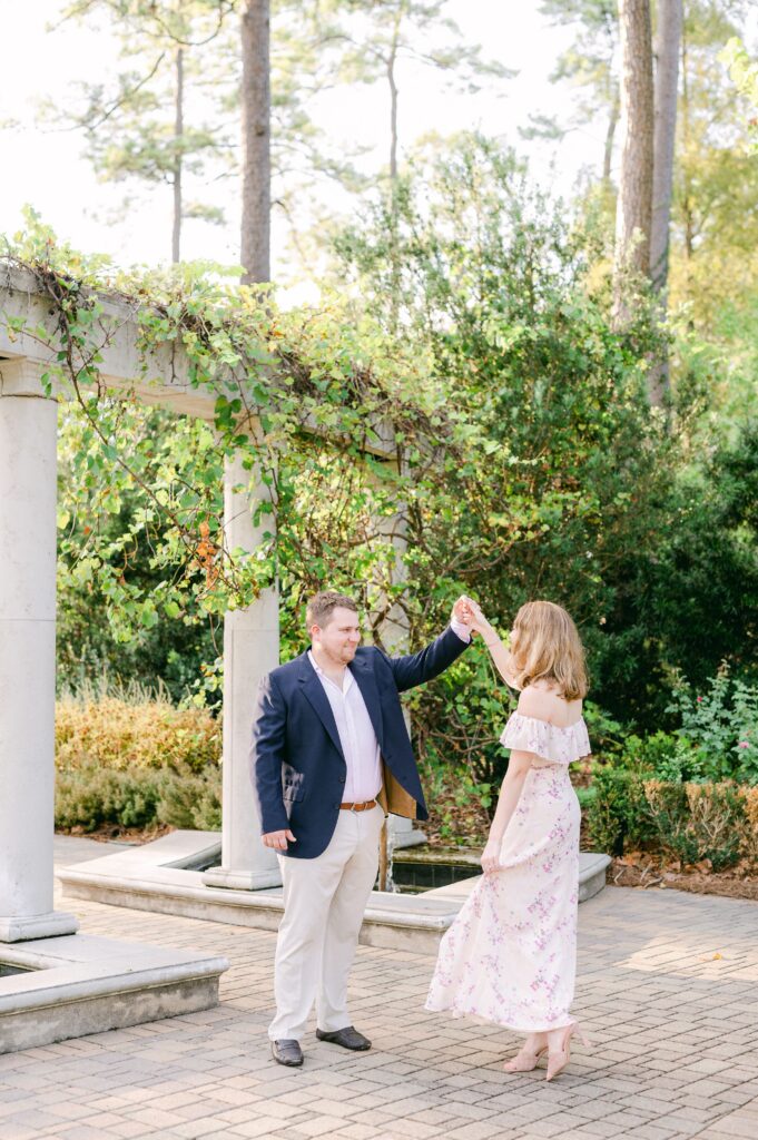 couple cuddling dancing engagement session in Houston