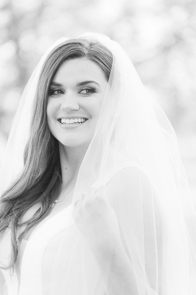 bride holding her veil in Katy, Tx