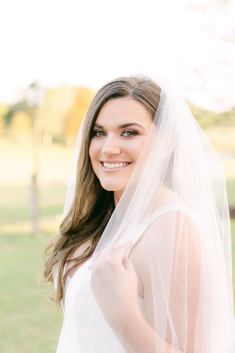 bride holding her veil in Katy, Tx
