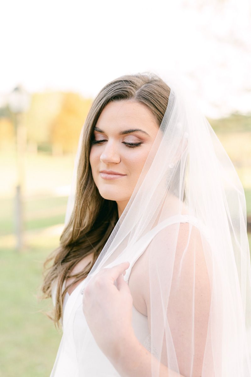 bride holding her veil in Katy, Tx