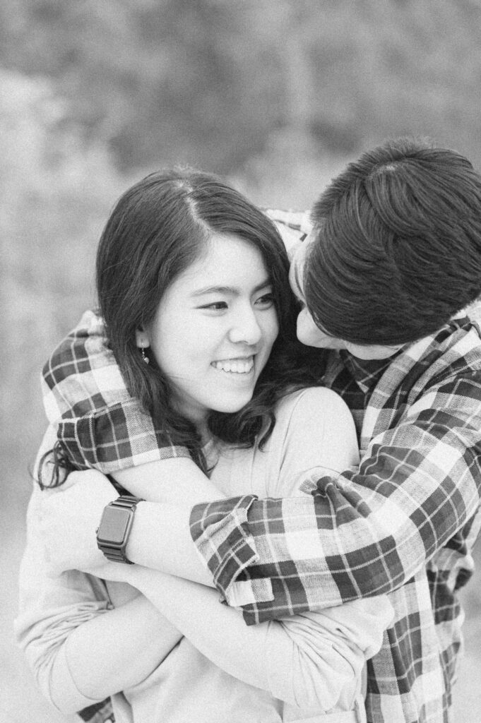 couple cuddling at engagement session