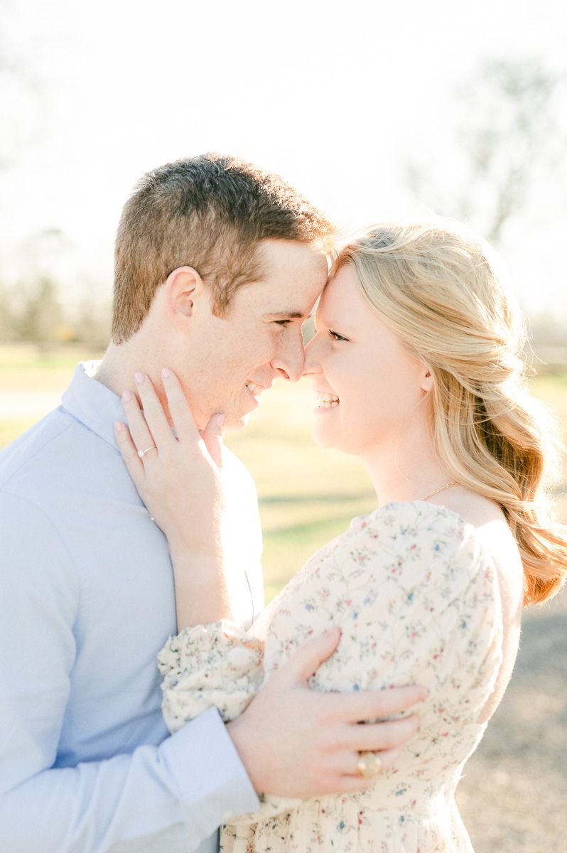 Engaged couple cuddling during Richmond engagement session