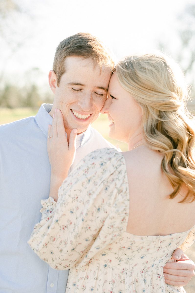 Engaged couple cuddling during Richmond engagement session