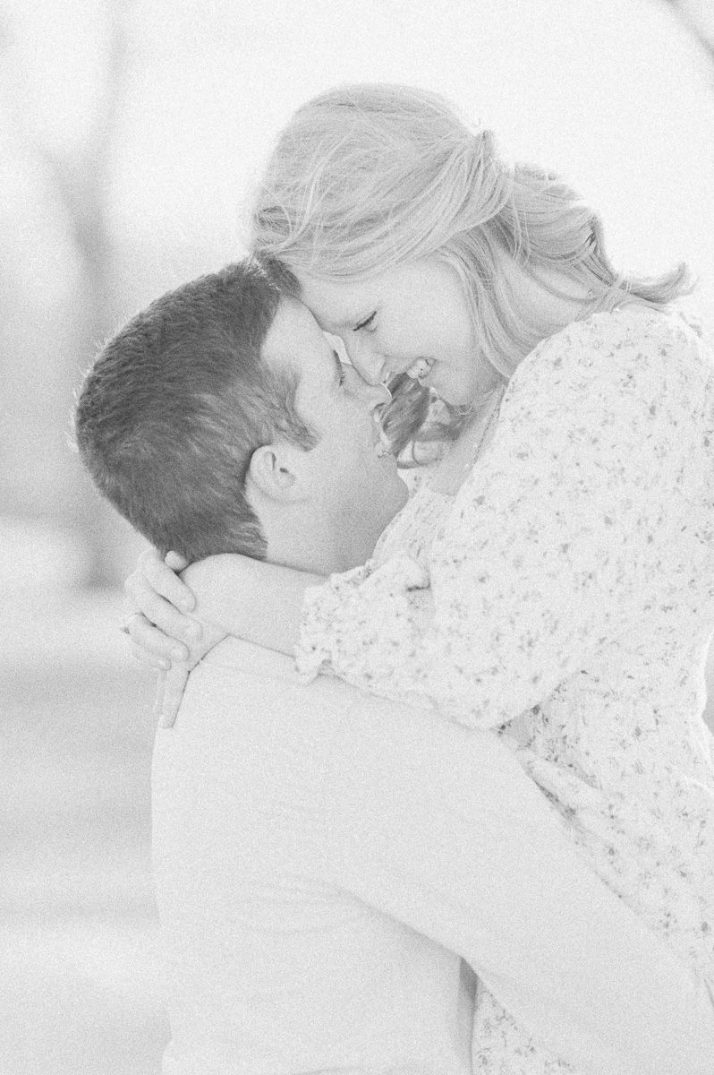 Couple cuddling during engagement session