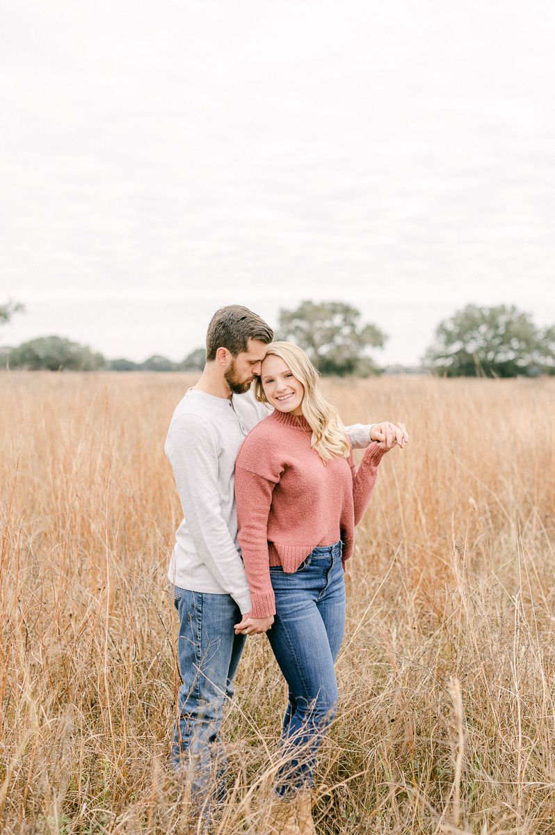 Engaged couple cuddling during engagement session