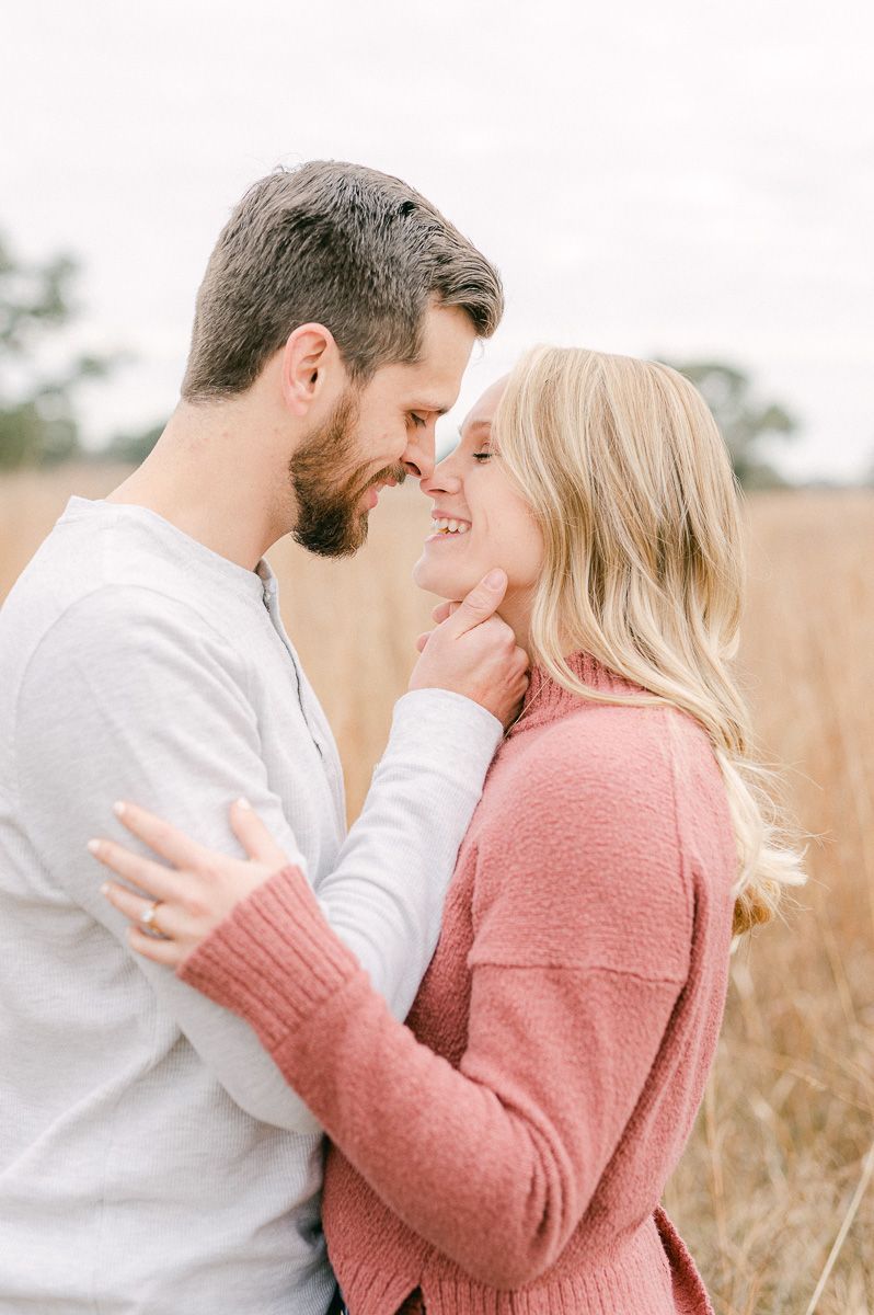 Engaged couple cuddling during engagement session