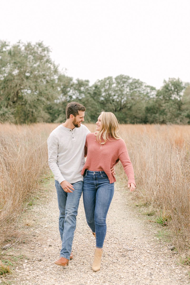 Engaged couple walking during engagement session