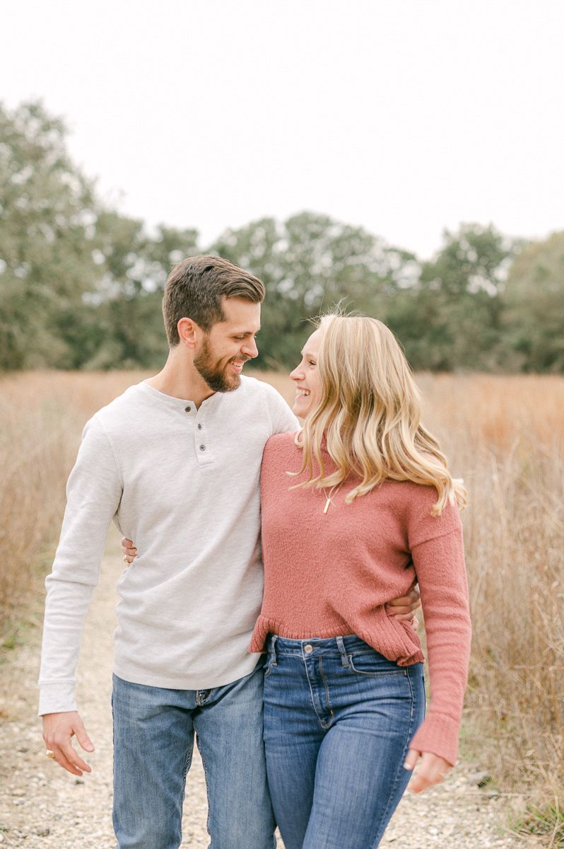Engaged couple walking during engagement session