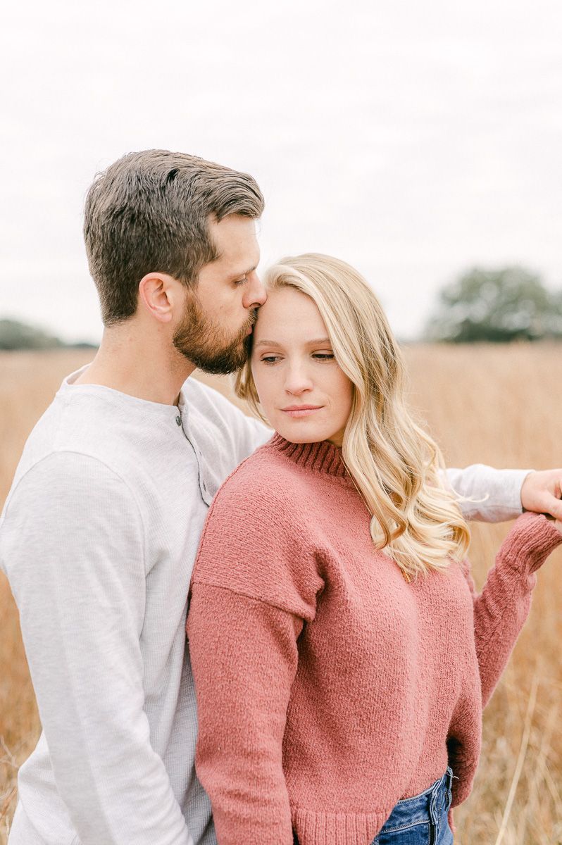 Engaged couple in pink and grey at Houston engagement session