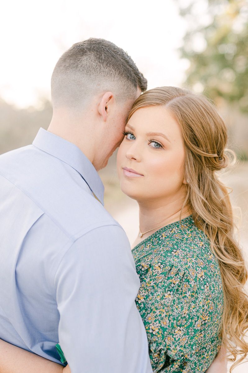Couple cuddling during their Cypress engagement session