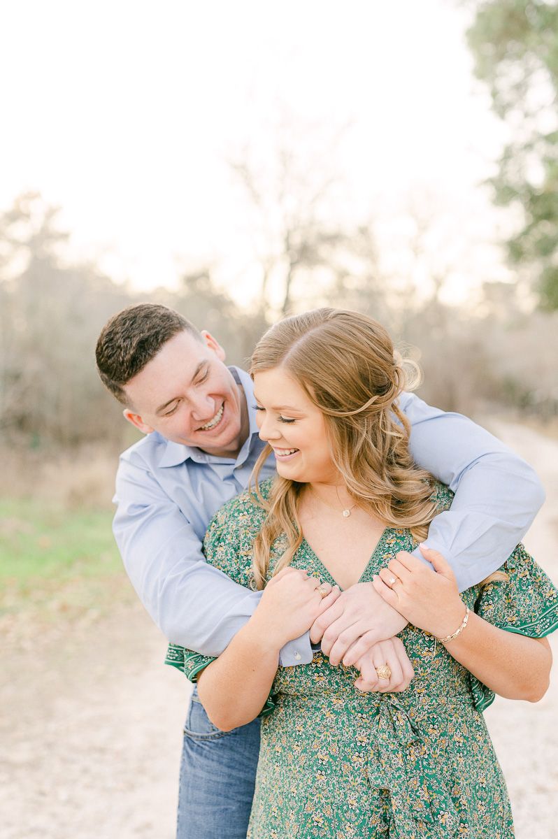 Couple cuddling during their Cypress engagement session