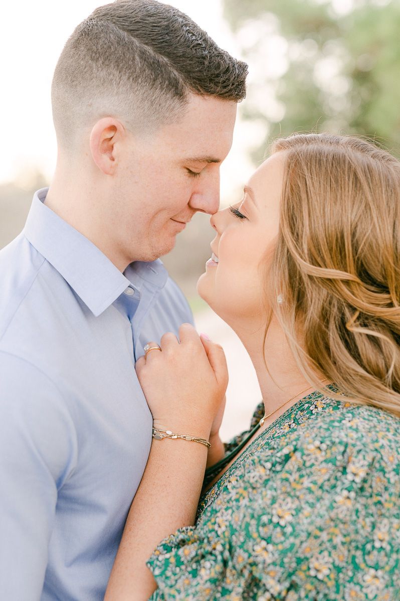 Couple cuddling during their Cypress engagement session